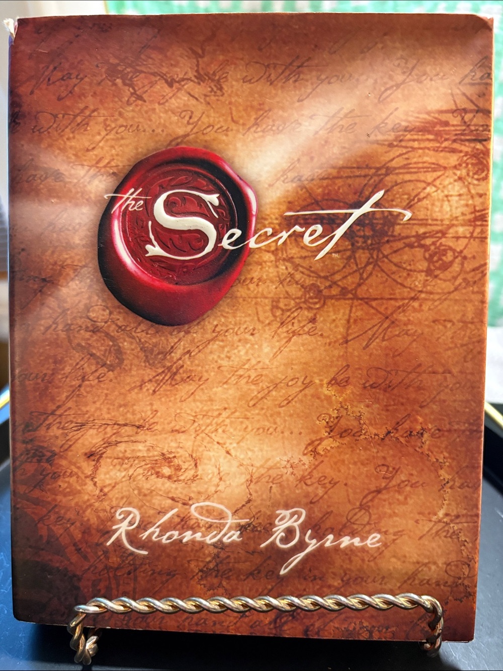 The Secret by Rhonda Byrne - Brown Hard Cover. 198 pgs.